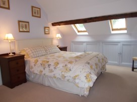 Comfortable king-sized bed in the Loft double room
